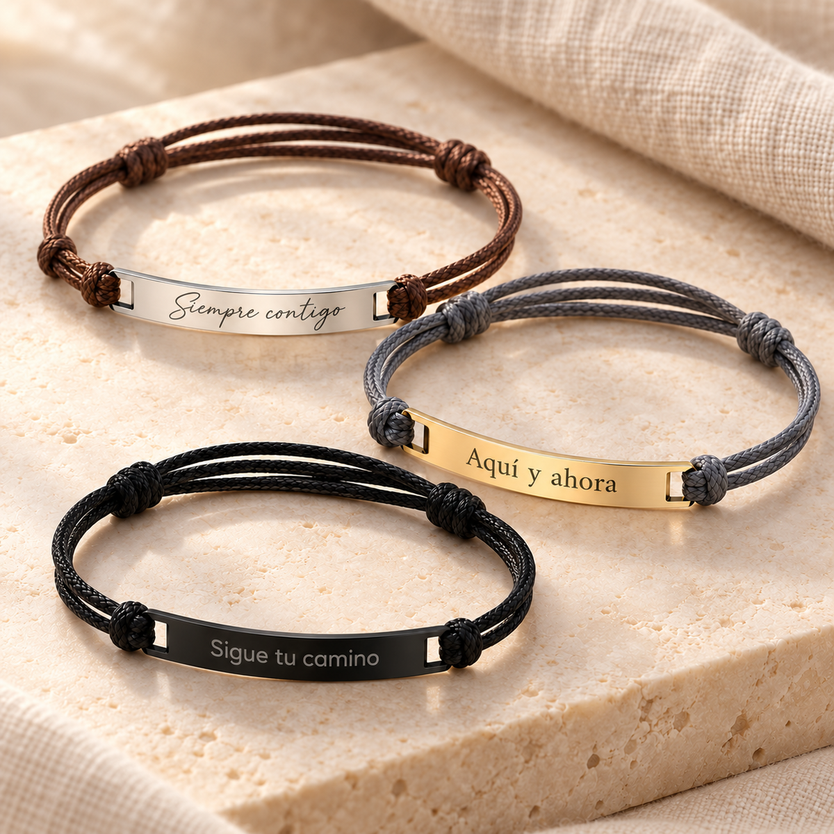 Pulseras Bali plateada con café, dorada con gris y negra con negro, con frases grabadas